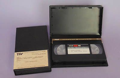 A box containig a vhs tape that has undergone research.