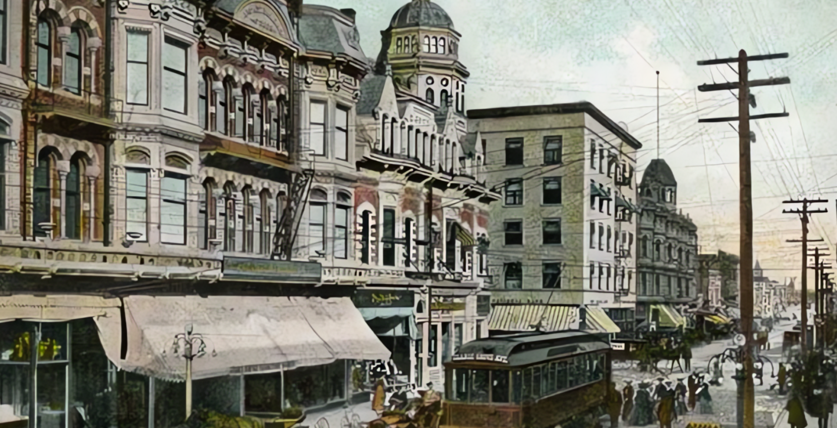 An old postcard shows a city street with a horse drawn carriage.