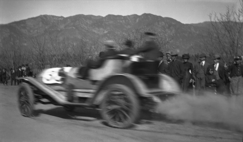 vintage photo of men in automobiles racing