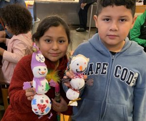 Two children enjoying the holiday themed Art2Go workshop